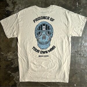 LARGE Cream “Prisoner of Your Own Mind” Rest Easy skull tee